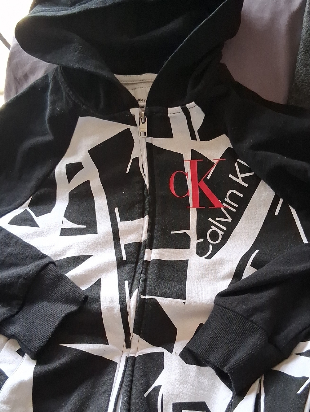 Calvin Klein Black & White Graphic Zip Hoodie with Red CK Accent